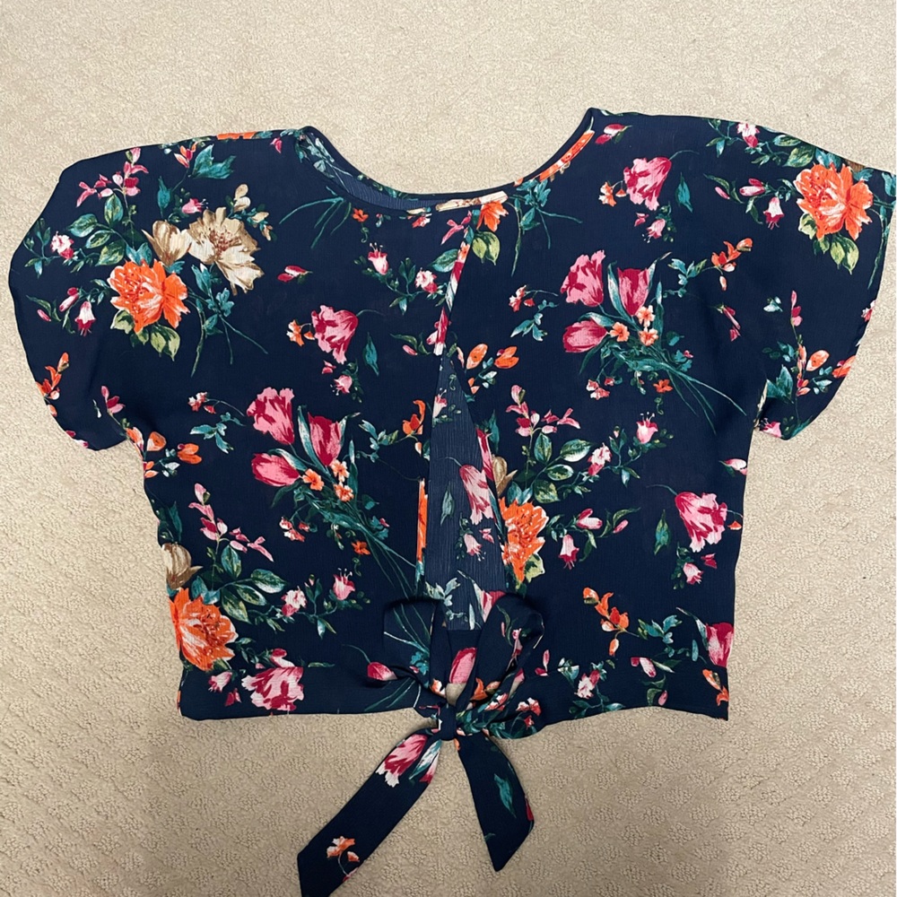 Blue floral shirt.